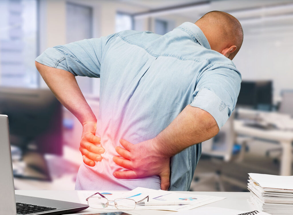 man suffering from back pain due to an injury springfield illinois