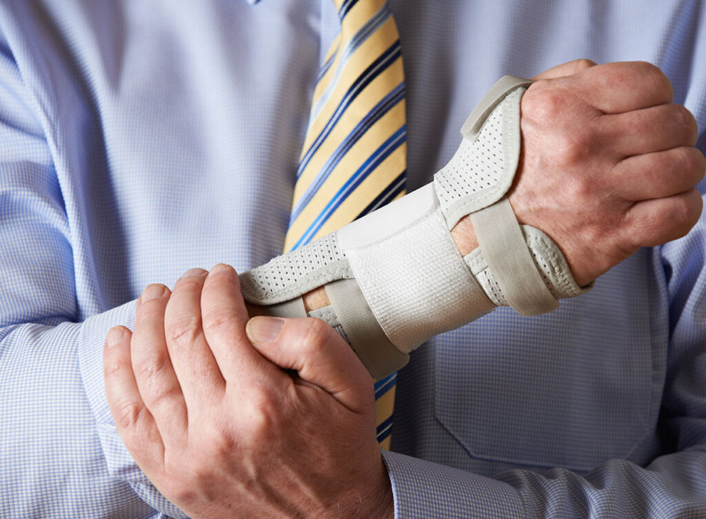 man holding arm that has a repetitive stress injury springfield illinois